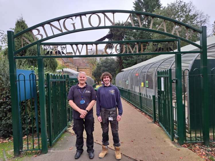 Students pose by the gates to Abington Aviary.