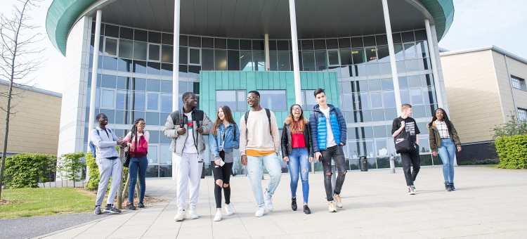 Students pose at the front of the College's main Booth Lane building.