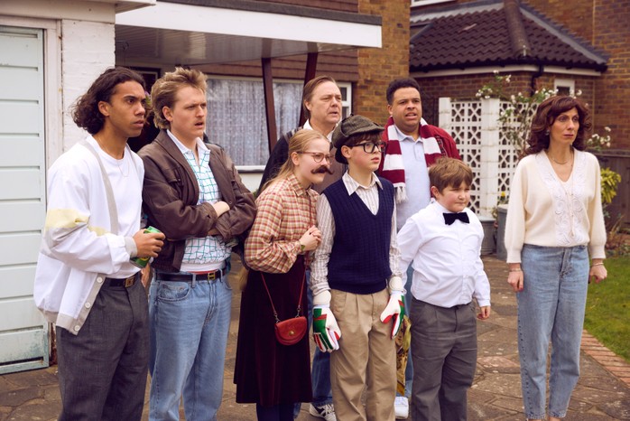 Cast of Changing Ends, including former NC student Josiah, pose outside of a house in a screen capture from the show.