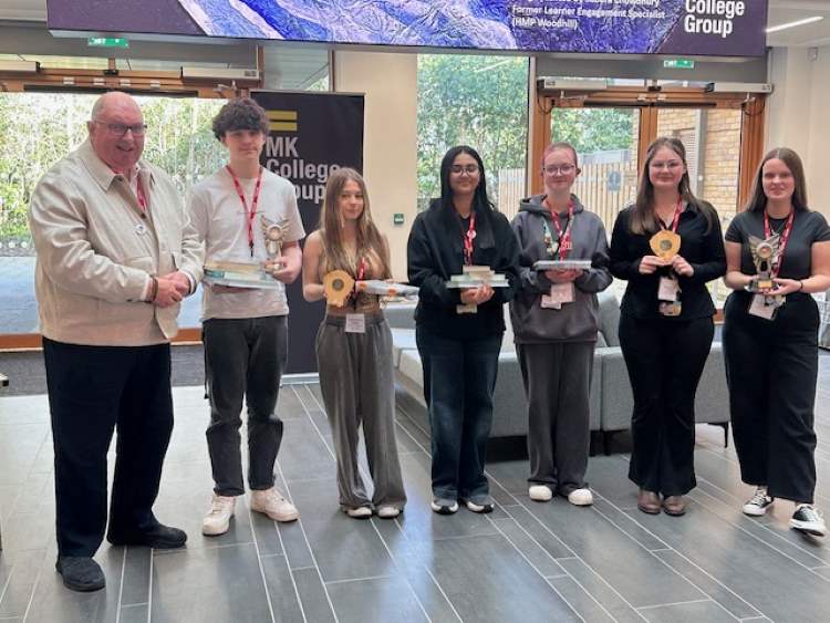 Photo shows Northampton College students posing with the trophies they were awarded at The Green Future Challenge 2025 competition.