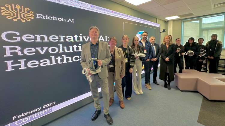 Photo shows Northampton College staff and students posing in the iLab with Lucy Rigby MP.